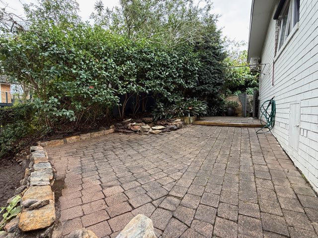 The same paved courtyard after clearing