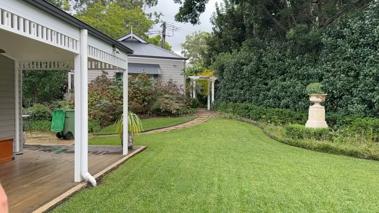 A finished lawn beside a veranda