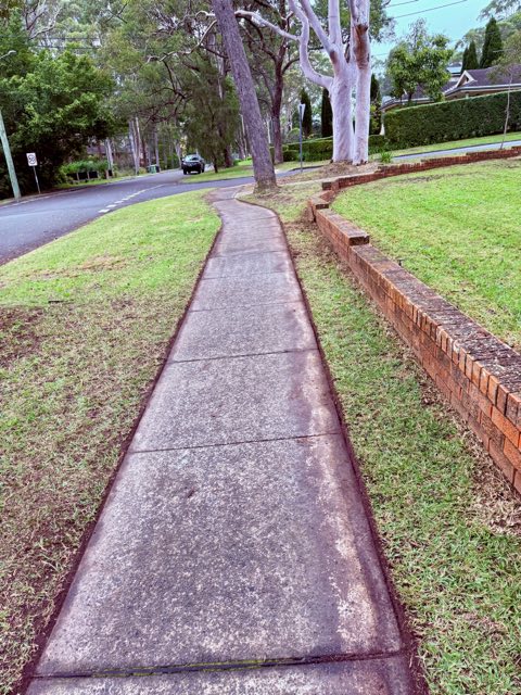 Footpath edges cut back razor straight