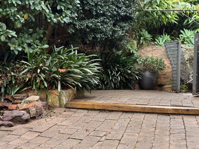 Paved sitting area weeded and washed